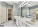 Spacious bathroom with double sinks, a large mirror, and a separate tub at 5163 Holly Springs Dr, Douglasville, GA 30135