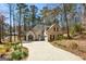 Charming two-story home with a neutral exterior, well-manicured lawn, and mature trees at 5163 Holly Springs Dr, Douglasville, GA 30135