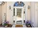 Inviting front entrance with decorative plants and a welcoming welcome mat at 5163 Holly Springs Dr, Douglasville, GA 30135