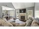 Bright living room features a fireplace, hardwood floors, and a comfortable seating area at 5163 Holly Springs Dr, Douglasville, GA 30135