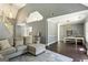 Open-concept living room with gray walls, natural light, and views of the study at 5163 Holly Springs Dr, Douglasville, GA 30135