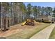 The community playground area features multiple play structures at 5163 Holly Springs Dr, Douglasville, GA 30135