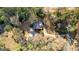 Beautiful aerial shot showcases a home surrounded by mature trees, highlighting its private setting at 135 Horseshoe Cir, Fayetteville, GA 30215