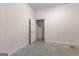 Basement with a painted floor with open door leading to another room at 135 Horseshoe Cir, Fayetteville, GA 30215