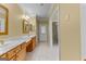 Bathroom featuring double sink vanities, tile flooring, and neutral walls at 135 Horseshoe Cir, Fayetteville, GA 30215