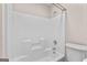 A full bathroom with a white tub, shower, and toilet at 135 Horseshoe Cir, Fayetteville, GA 30215