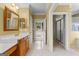 Bathroom vanity featuring framed mirror, warm paint, and traditional faucet at 135 Horseshoe Cir, Fayetteville, GA 30215
