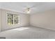 Bedroom with a large window providing natural light and scenic view at 135 Horseshoe Cir, Fayetteville, GA 30215