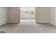 Bedroom with neutral carpet and a large window, providing lots of light at 135 Horseshoe Cir, Fayetteville, GA 30215
