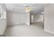 Spacious carpeted bedroom with ceiling fan and multiple closets at 135 Horseshoe Cir, Fayetteville, GA 30215