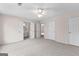 Bedroom with large closets, neutral carpet, and ceiling fan with ample natural light at 135 Horseshoe Cir, Fayetteville, GA 30215