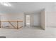 Large bonus room with carpet, multiple doors, and staircase at 135 Horseshoe Cir, Fayetteville, GA 30215