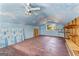 Finished bonus room features faux-painted ceilings and wood shelving at 135 Horseshoe Cir, Fayetteville, GA 30215