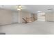 Large bonus room with neutral carpet, multiple rooms, and ceiling fans at 135 Horseshoe Cir, Fayetteville, GA 30215