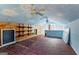 Finished bonus room features faux-painted ceilings and wood shelving at 135 Horseshoe Cir, Fayetteville, GA 30215