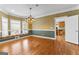 Dining room with hardwood floors, bay window, and classic chandelier at 135 Horseshoe Cir, Fayetteville, GA 30215