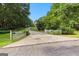 Long driveway leads to a charming home surrounded by lush greenery at 135 Horseshoe Cir, Fayetteville, GA 30215