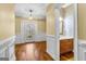 Entryway with a decorative glass front door and half bath at 135 Horseshoe Cir, Fayetteville, GA 30215