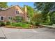 Landscaped side of the home featuring a brick chimney and decorative flower beds at 135 Horseshoe Cir, Fayetteville, GA 30215