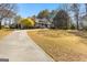 Inviting home with a sprawling front yard and a long driveway leading to the main house at 135 Horseshoe Cir, Fayetteville, GA 30215