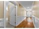 Hallway with wainscoting and hardwood floors that leads to the front door at 135 Horseshoe Cir, Fayetteville, GA 30215