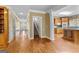 View of the hallway featuring hardwood floors and access to multiple rooms at 135 Horseshoe Cir, Fayetteville, GA 30215