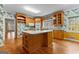 Open concept kitchen features a large island with counter seating and views to a breakfast room at 135 Horseshoe Cir, Fayetteville, GA 30215
