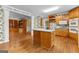 The kitchen offers open sight lines to the breakfast area and built-in shelving area at 135 Horseshoe Cir, Fayetteville, GA 30215