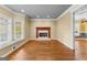 Bright room with hardwood floors, fireplace, large window, and window seat at 135 Horseshoe Cir, Fayetteville, GA 30215