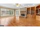 Spacious living room with hardwood floors, stone fireplace and built-in shelving at 135 Horseshoe Cir, Fayetteville, GA 30215