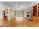 Spacious living room with a stone fireplace and built-in shelving and cabinets at 135 Horseshoe Cir, Fayetteville, GA 30215