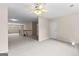 A large living room with neutral carpet and ceiling fan at 135 Horseshoe Cir, Fayetteville, GA 30215