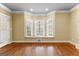 Sun-filled living room featuring hardwood floors, and bay window with a seat at 135 Horseshoe Cir, Fayetteville, GA 30215