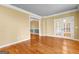 Open living room with hardwood floors, large doorway, and french doors to another room at 135 Horseshoe Cir, Fayetteville, GA 30215