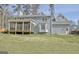 Charming home featuring a screened porch, bay window, and well-maintained lawn, perfect for outdoor living at 233 Creekstone Bnd, Peachtree City, GA 30269