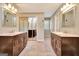 Bathroom with double vanity sinks, mirrored closets and neutral carpet at 233 Creekstone Bnd, Peachtree City, GA 30269