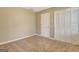 Neutral empty bedroom featuring carpet, a closet, and a window with bright natural light at 233 Creekstone Bnd, Peachtree City, GA 30269