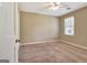 Bedroom with a neutral color scheme, carpeted floor, and window with blinds at 233 Creekstone Bnd, Peachtree City, GA 30269