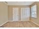 Empty bedroom featuring neutral carpet, a closet, white trim, and a window with blinds at 233 Creekstone Bnd, Peachtree City, GA 30269