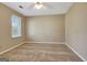 Empty bedroom features neutral carpet, a window with blinds, and overhead fan light at 233 Creekstone Bnd, Peachtree City, GA 30269