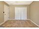 Bedroom with carpeted floors, a closet, and a door leading to another room at 233 Creekstone Bnd, Peachtree City, GA 30269