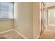 Corner bedroom featuring beige walls, carpet, natural light, and closet with mirrored doors at 233 Creekstone Bnd, Peachtree City, GA 30269