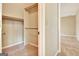 Bright, empty walk-in closet with carpet and rod for hanging clothes at 233 Creekstone Bnd, Peachtree City, GA 30269