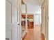 View of kitchen with hardwood floors, granite countertops, wooden cabinets, and modern appliances at 233 Creekstone Bnd, Peachtree City, GA 30269