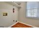 Laundry room with utility connections, white shelving, and window with bright natural light at 233 Creekstone Bnd, Peachtree City, GA 30269