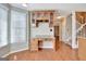 Office space with built-in desk, cabinets, and natural light from the window at 233 Creekstone Bnd, Peachtree City, GA 30269