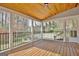 Screened porch features wood floors, a ceiling fan, and a railing with views at 233 Creekstone Bnd, Peachtree City, GA 30269