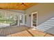 Covered porch featuring wood floors, a ceiling fan, and access to the yard at 233 Creekstone Bnd, Peachtree City, GA 30269