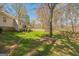 Lush backyard with a wooden deck, mature trees, and a privacy fence for outdoor enjoyment at 104 Amberidge Nw Dr, Cartersville, GA 30121