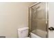 Standard bathroom with a toilet and a framed shower with sliding doors at 104 Amberidge Nw Dr, Cartersville, GA 30121